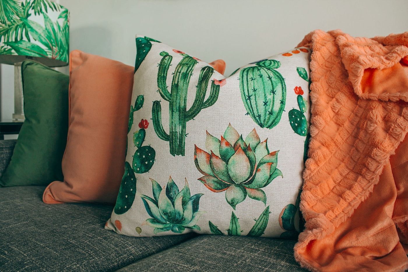 Colourful decorative cushions arranged on a sofa