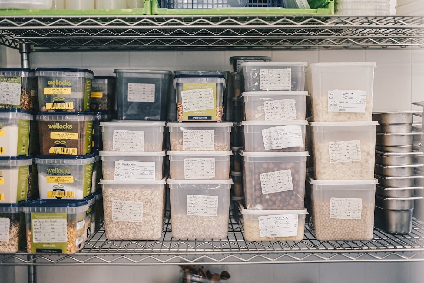 Organized pantry shelves filled with clear food storage containers