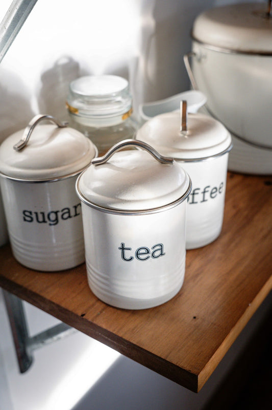 Kitchen canisters for tea coffee and dry ingredients on a counter